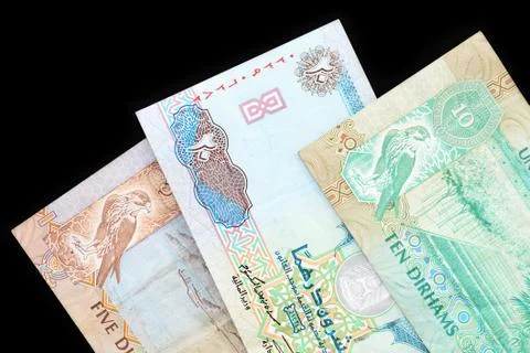 UAE dirham currency notes on a dark background close up Stock Photos