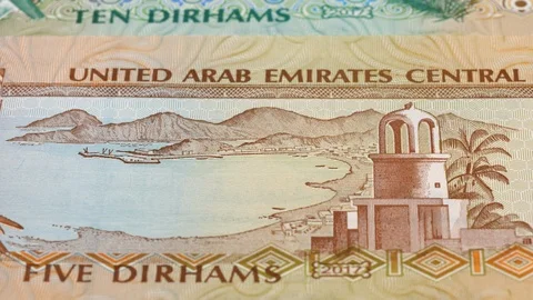 UAE dirham notes tracking. Slider shot. Low angle, macro. 4K Stock Footage 125909876