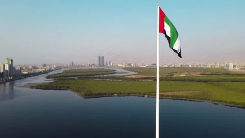 UAE flag and Ras al Khaimah emirate in the north United Arab Emirates aerial  Stock Footage 167130366