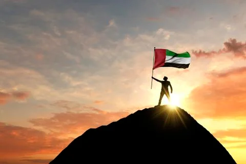 UAE flag being waved at the top of a mountain summit. 3D Rendering 스톡 일러스트