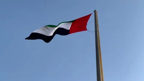 The UAE flag develops in the sky in the wind. Stock Footage 171112254