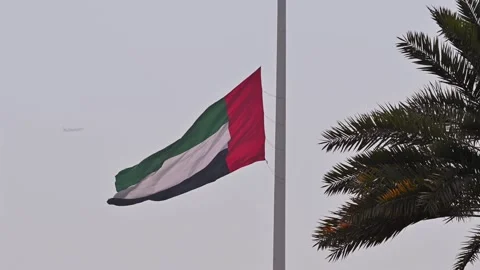 The UAE flag at half-mast honouring a period of national mourning. Stock Footage 341615574