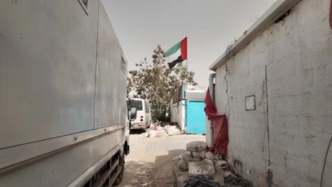 A UAE flag waving in the air in an old town in Sharjah, UAE. Stock Footage 335940380