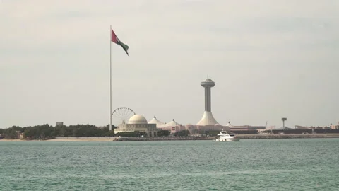 UAE flag waving in the wind in Al Marina, Abu Dhabi, United Arab Emirates Stock Footage 182075705
