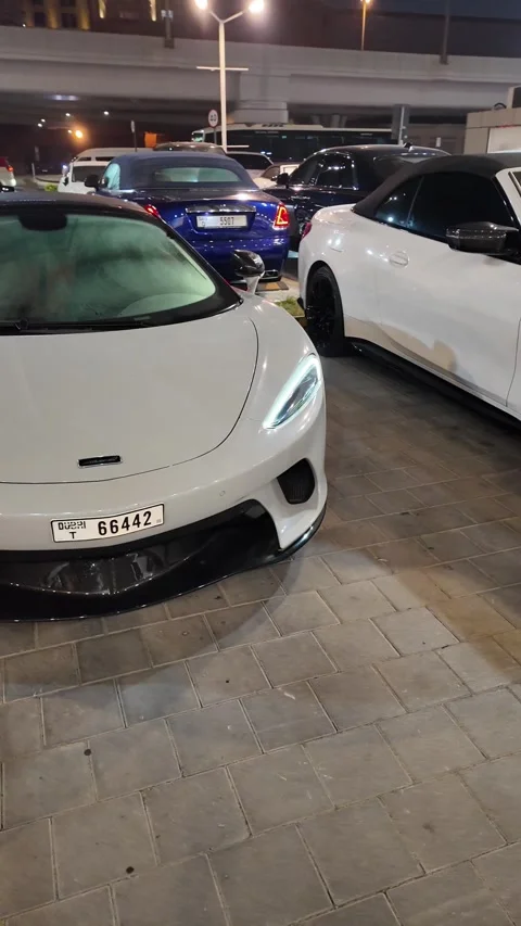 UAE, September 10, 2026: Luxury and exotic supercars parked at night⁠ Video stock 345181784