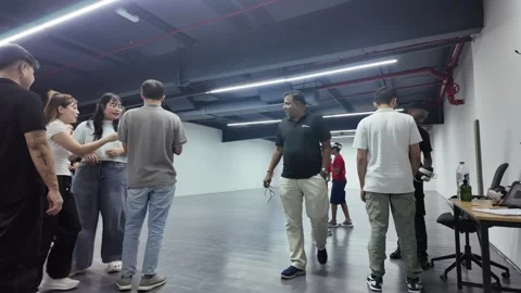 UAE - September 25, 2026 - Visitors experiencing immersive VR gaming and in.. Stock Footage 346459983