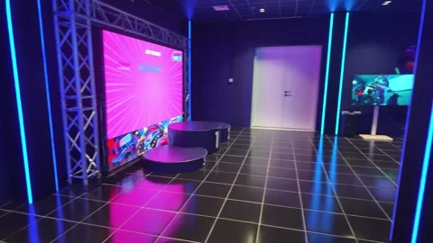 UAE - September 25, 2026 - Visitors experiencing immersive VR gaming and in.. Stock Footage 346468962