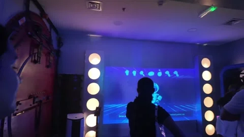 UAE - September 25, 2026 - Visitors experiencing immersive VR gaming and in.. Stock Footage 346469379