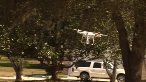 UAV-19, drone helicopter MS to CU flys to camera and hovers Stock Footage 47217355