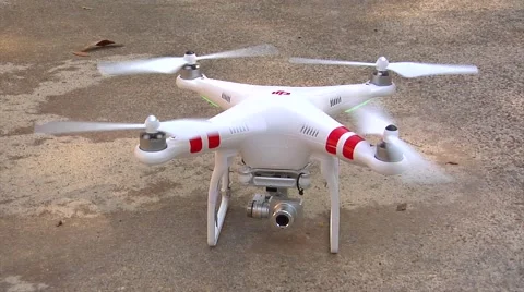 UAV-2, drone helicopter CU lifts off, leaves frame Stock Footage 47277872