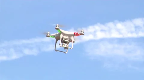 UAV-22, drone helicopter MWS, flys right to left under blue sky/tree Stock Footage 47210992