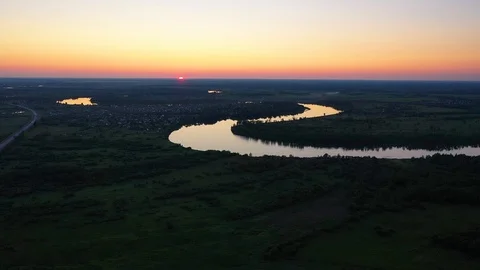 UAV flight over the river at sunset . beautiful scenery Vídeo Stock 113004372
