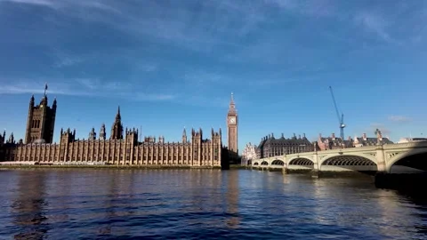 Uber boat navigating the River Thames in London with the Houses of Parliament Stock-Footage 328333584