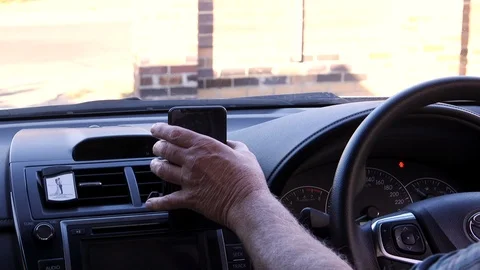 An Uber driver opening the app and checking his earnings. Stock Footage 107131980
