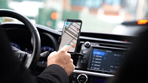 Uber driver use navigating on smartphone Stock Footage 92208105