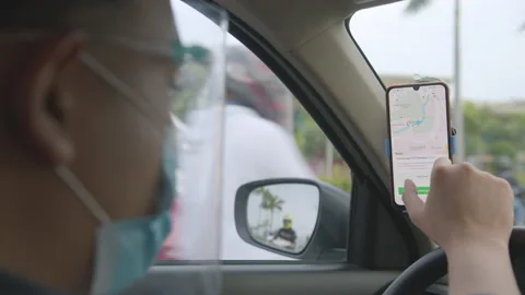 Uber Driver Wearing Face Mask And Face Shield While Using Waze On His Stock Footage 142008331