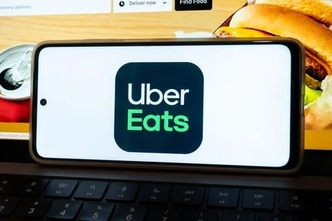 Uber eats app logo on smartphone screen Stock Photos
