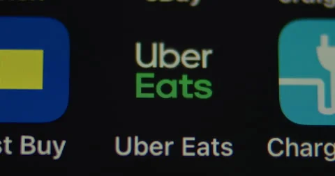 Uber Eats App on Smartphone. Macro close up. select and open App. Stock Footage 149546692