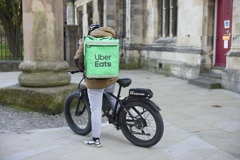 Uber Eats delivery driver on a bicycle. York, UK Stock Photos
