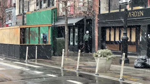 Uber Eats delivery man bicycle buzzing intercom waiting for door to open NYC Stock Footage 147309011