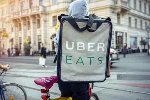 Uber eats food delivery bicycle driver Stock Photos