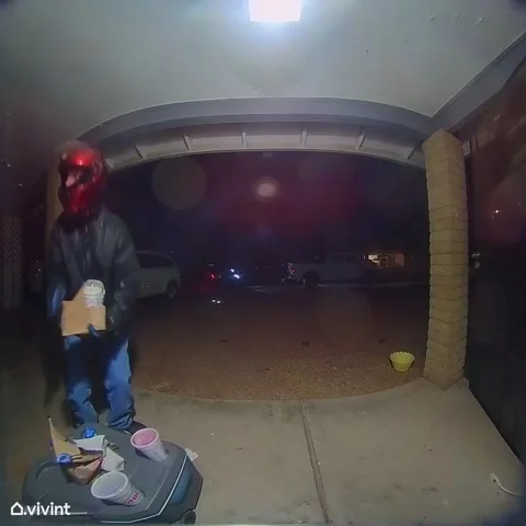 Uber Eats Moped Driver Drops Food on the Ground, Glendale, Arizona, USA - 18 Mar Stock Footage 205424161