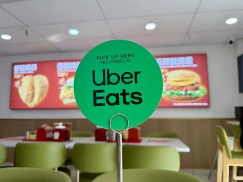Uber Eats Pick Up Sign Inside Fast Food Restaurant Interior Stock Photos