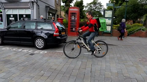 An uber eats rider delivering food by bicycle Stock Footage 92074869