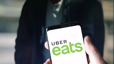Uber Eats on a Smartphone app and Computer Screen Stock Footage 152118358