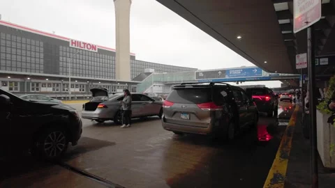 Uber, Lyft, Taxi picking up people in O'Hare International Airport, Chicago - 4K Stock Footage 310526182