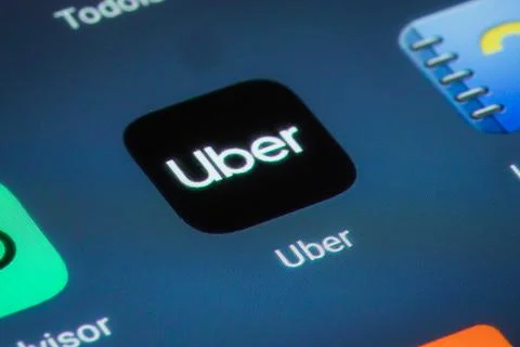 Uber mobile app on a smartphone screen Stock Photos