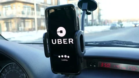 Uber Phone app Loading While Driving the Car on The Street Stock Footage 146589620