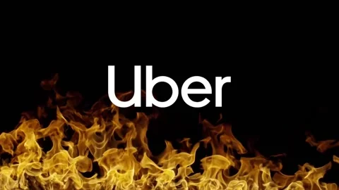Uber Technologies Inc. logo on fire. Illustrative editorial Stock Footage 148453582