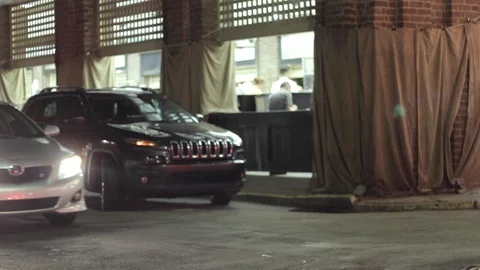 An Uber/lyft driver goes down a street looking for passengers. Stock Footage 93656940