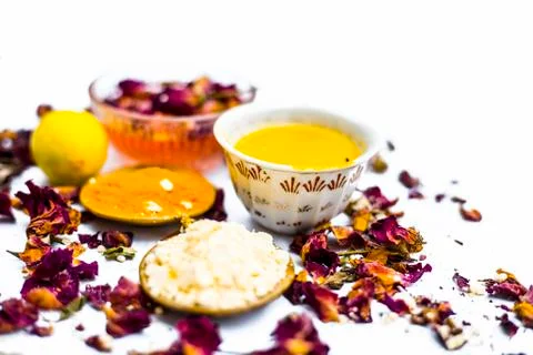 Ubtan or face pack of lemon and gram flour with rose water with some rosa leaves Stock Photos