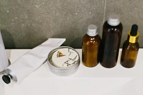 Ubtan for skin in glass bottle, solid shampoo in metal can, tonic,  condition 스톡 사진