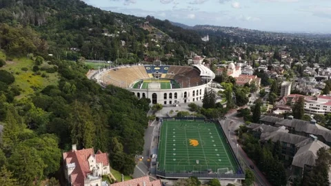 UC Berkeley Memorial Stadium and practice field with golden C logo, Sather Stock Footage 336504301
