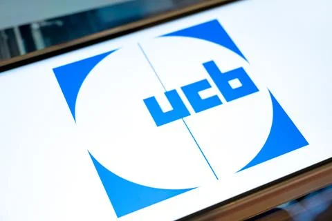 Ucb pharma logo shown on generic device surface Stock Photos