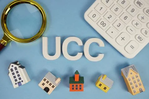 UCC abbreviation of Uniform Commercial Code alphabet letters with house mod.. Stock Photos