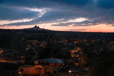 Uchisar castle at dusk Stock Photos