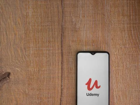 Udemy app launch screen with logo on the display of a black mobile smartphone Stock Photos