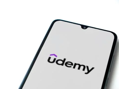 Udemy app launch screen on smartphone on white background Stock Photos