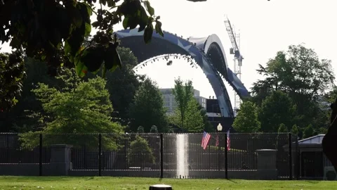 The UFC arch structure being built on the South Lawn behind fencing Stock Footage 345283459