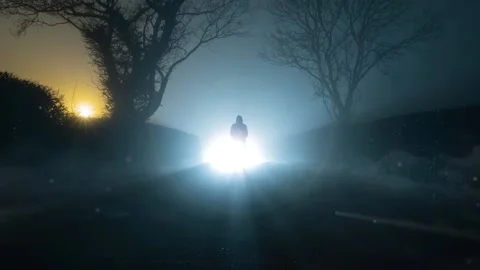 A UFO concept of lights floating in the sky, with a scary, mysterious figure Stock Footage 166456327