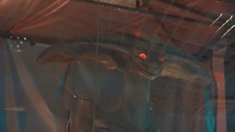 Ufo creature on two massive legs. Located behind clear glass with reflections.Bo Stock Footage 98865772