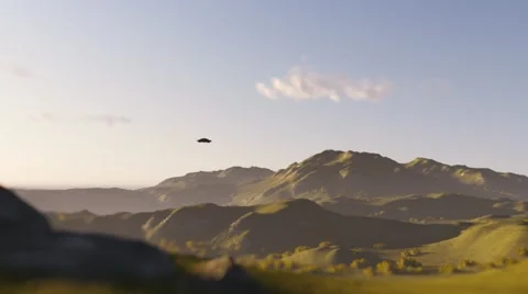 Ufo Disc Flying in day time over mountains Stock Footage 64680790