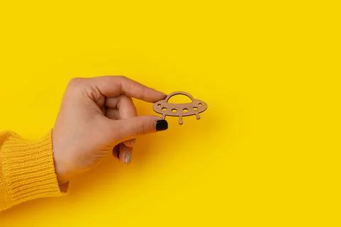 UFO in hand Stock Photos