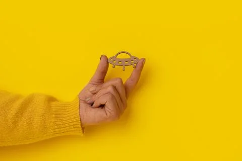 UFO in hand Stock Photos