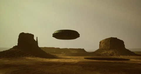 UFO hovering over desert landscape with rock formations in the distance Vídeos de archivo 304517996