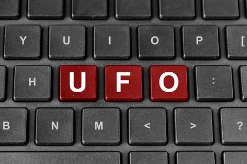 Ufo or unidentified flying object word on keyboard Stock Photos